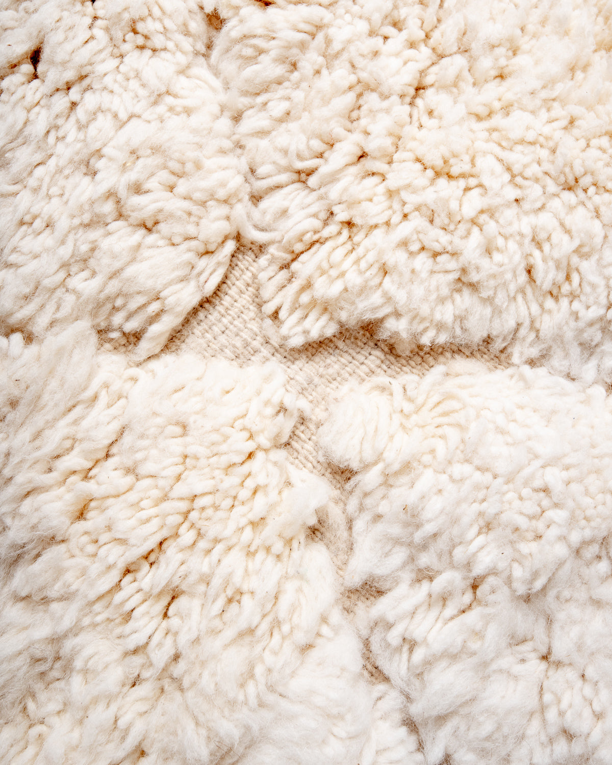 Modern, designer, handcrafted Berber rug from Morocco. Beniourain carpet with minimalist design, natural wool pile and a fluffy texture.